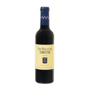 Les Hauts de Smith 2020 red wine bottle, blue cap, front label on dark glass