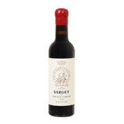 Wine bottle with red cap and dark glass, white label reading Sarget and Gruaud Larose