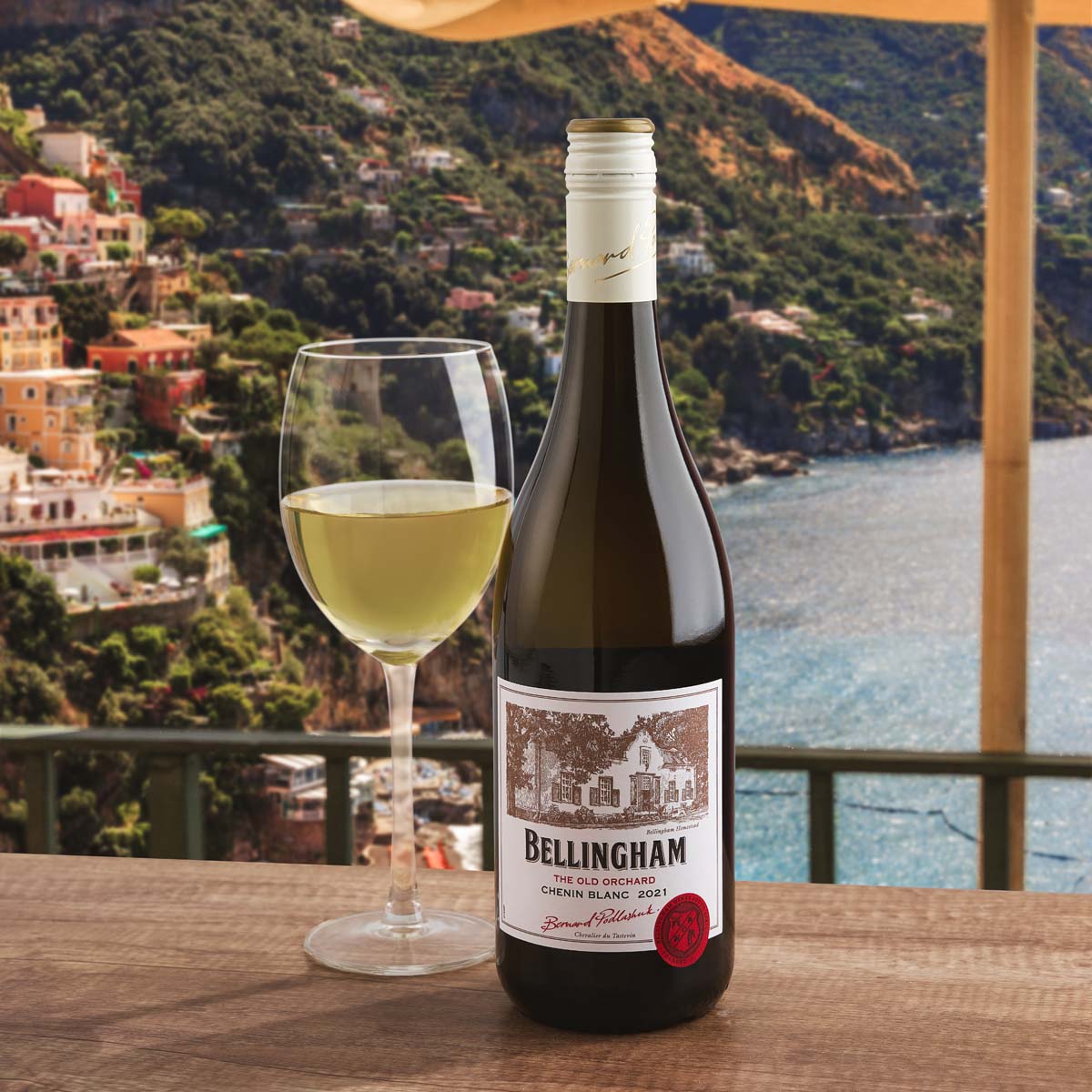 Chenin Blanc wine bottle with white wine glass, front label visible