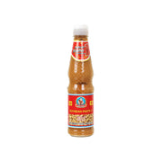 Soybean paste bottle with clear cap, red label, and brown paste filling