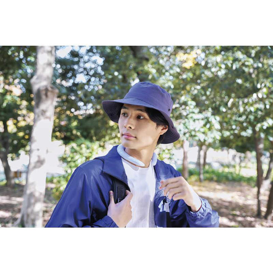 Cooling neck ring around neck, visible under blue jacket and hat
