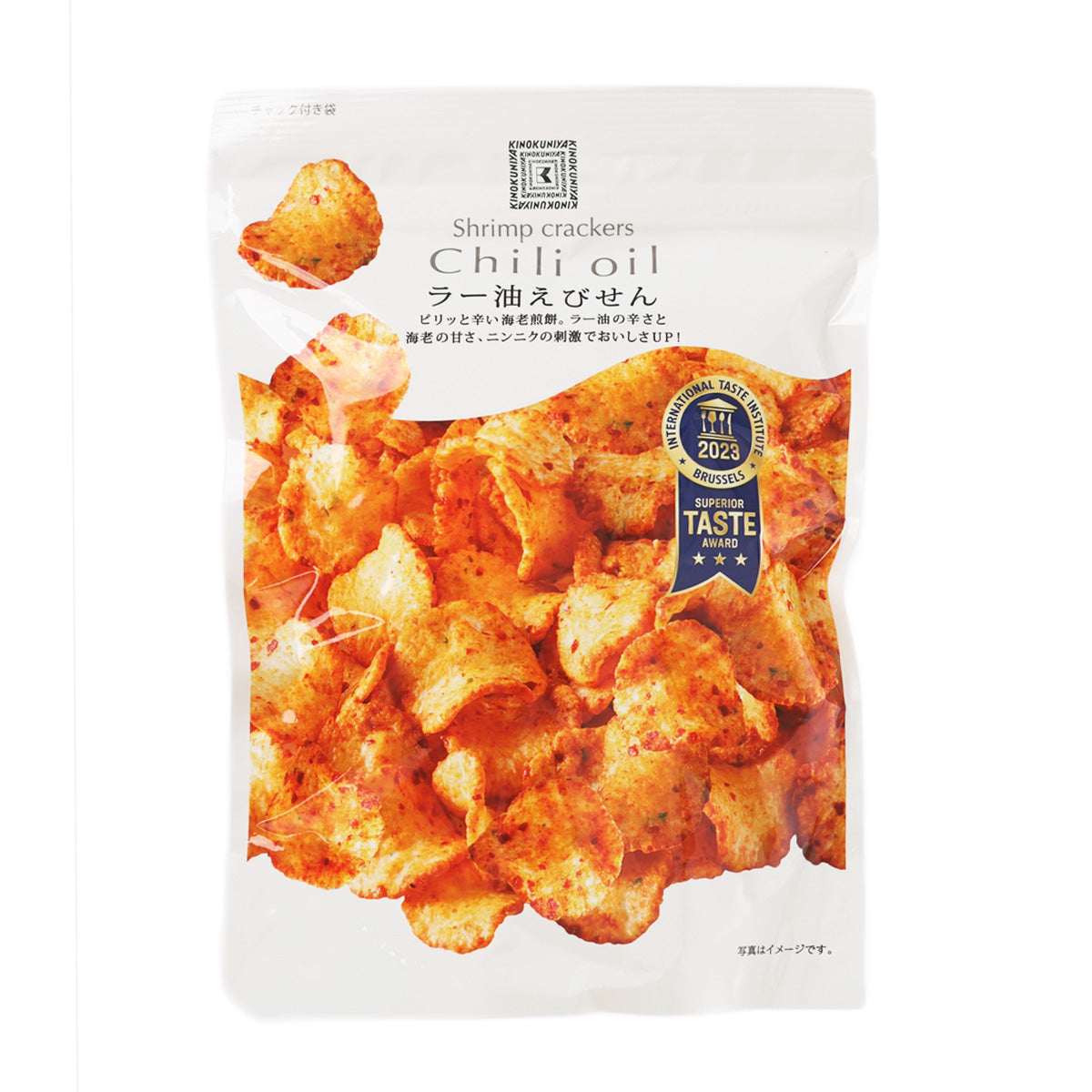 KINOKUNIYA chili oil shrimp crackers in white pouch, orange seasoned crackers visible
