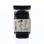 Jar of seasoned nori seaweed cuts with black lid and clear plastic container