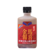 Pistachio milk drink bottle with red label, gold Chinese text, and black cap