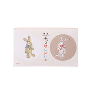 Cookie gift box with bunny graphics on light pink and beige front