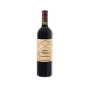 2021 red wine bottle with front label and dark burgundy glass