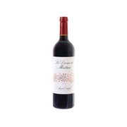 Red-capped wine bottle with dark glass and cream front label
