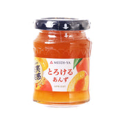Apricot jam jar in clear glass with blue screw lid, orange jam visible