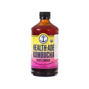 HEALTH-ADE kombucha bottle with berry lemonade label, dark amber drink, black cap.