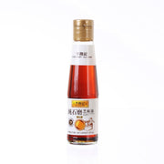 LEE KUM KEE fragrant sesame oil bottle, gold cap and red-tinted liquid, 207 mL
