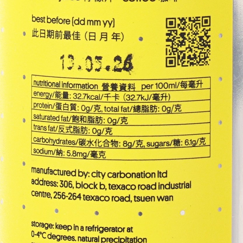 Lemon coffee soda nutrition panel close-up with best-before date and QR code