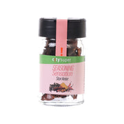 Star anise seasoning in clear glass bottle with black cap