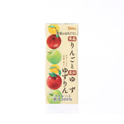 Apple yuzu 100% juice carton, front view with fruit illustrations and Shiny logo