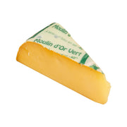 ALLEGRA low-salt Gouda cheese wedge, yellow semi-hard cheese with green label wrap