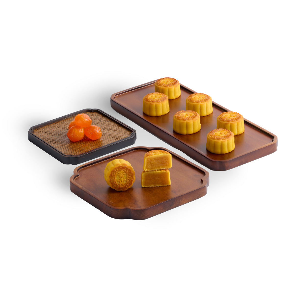 Mini egg custard mooncakes on three trays, golden rounds and halves