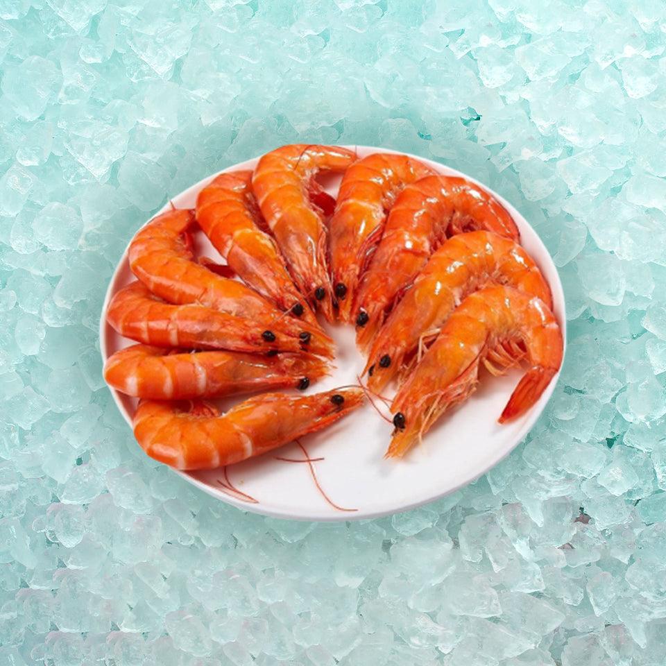 Cooked vannamei prawns, orange shrimp arranged on a plate
