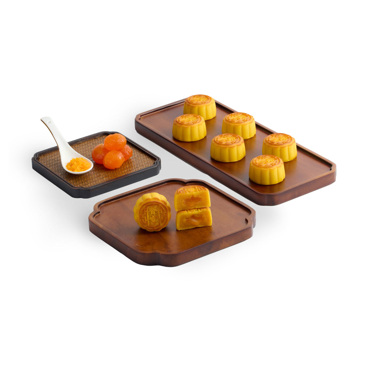 Mini lava egg custard mooncakes in three trays, orange filling visible