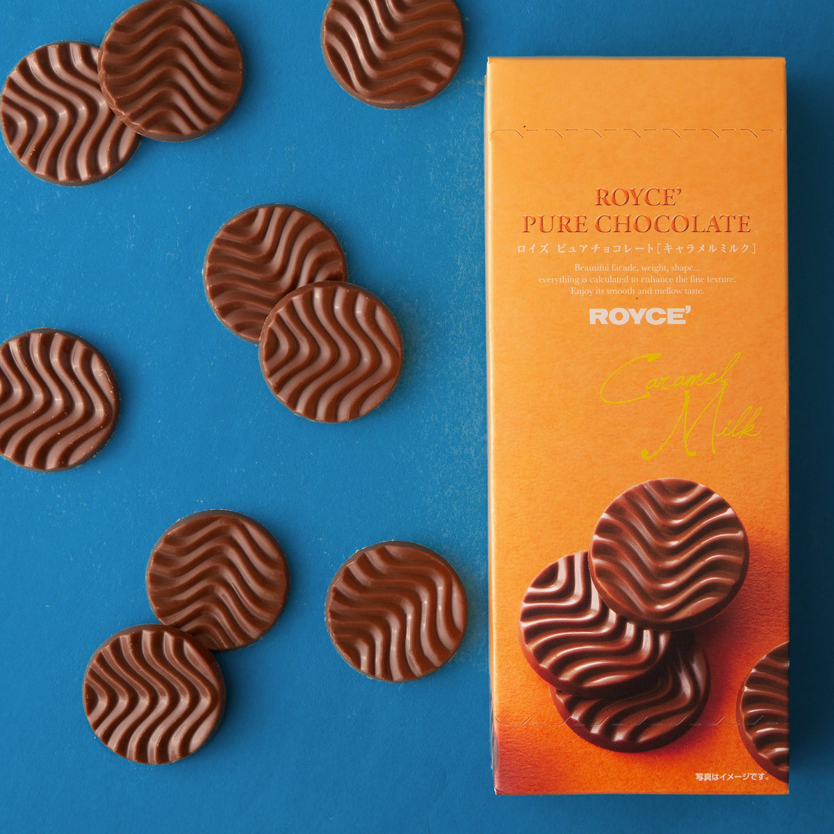 Heart-shaped caramel milk chocolates around a pure chocolate box.