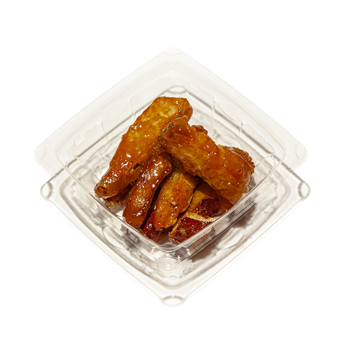 Sweet potato stick snack in clear plastic tray, golden-brown fried sticks
