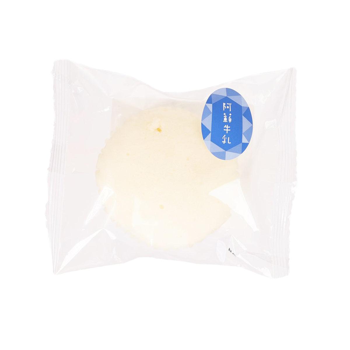 Steamed milk cake in white plastic package, front view with blue round label