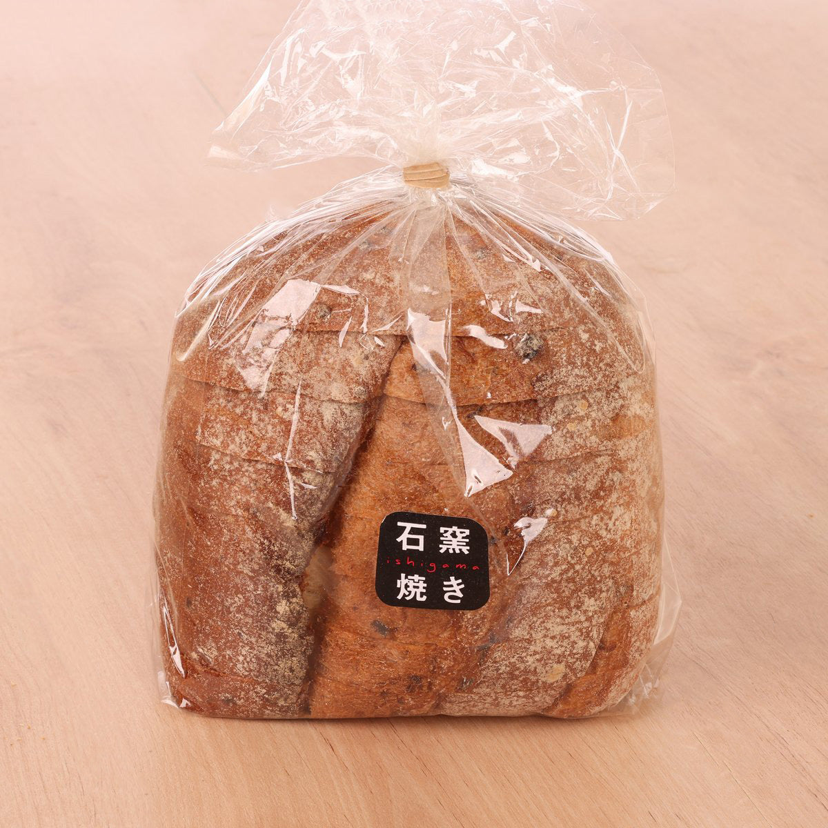 Stone-baked cereal bread loaf in clear bag with label, 8 pieces