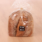 Stone-baked cereal bread loaf in clear bag with label, 8 pieces