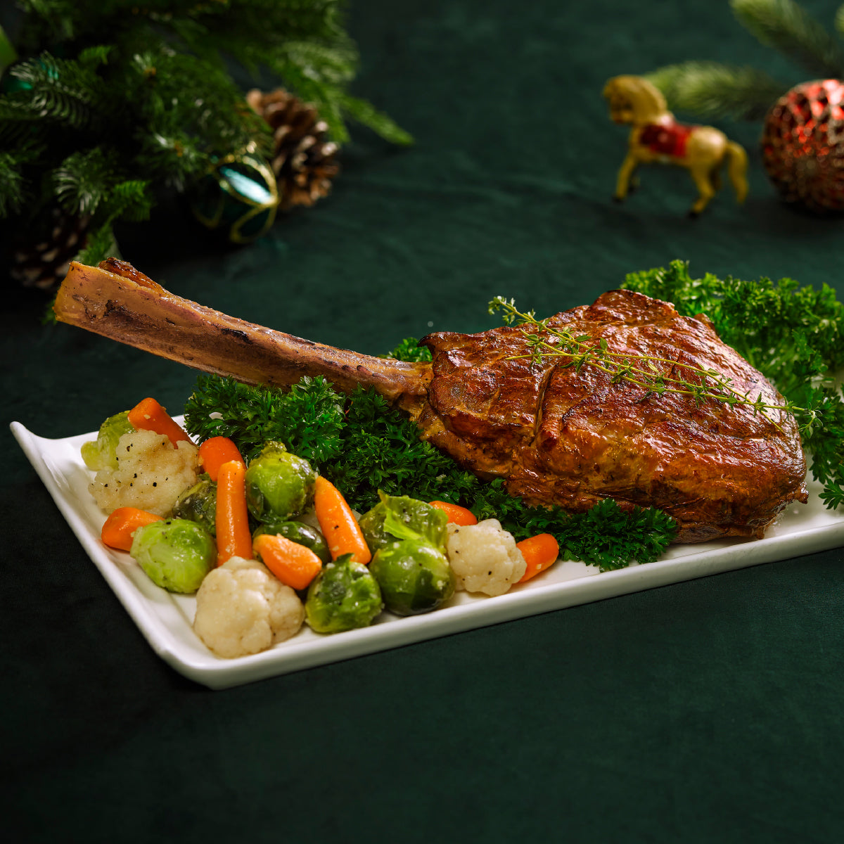 Roasted beef tomahawk steak with herb seasoning, served on a platter with vegetables