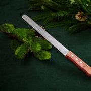 Z02 carving knife with stainless serrated blade and reddish-brown wooden handle, 3 rivets