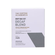 Decaf drip bag set box with THE COFFEE ACADEMICS branding and DECAF BLEND text