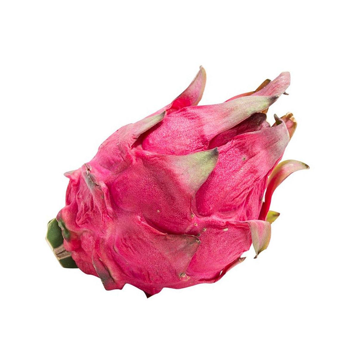 Dragon fruit pieces with magenta-red flesh and green-tipped outer skin