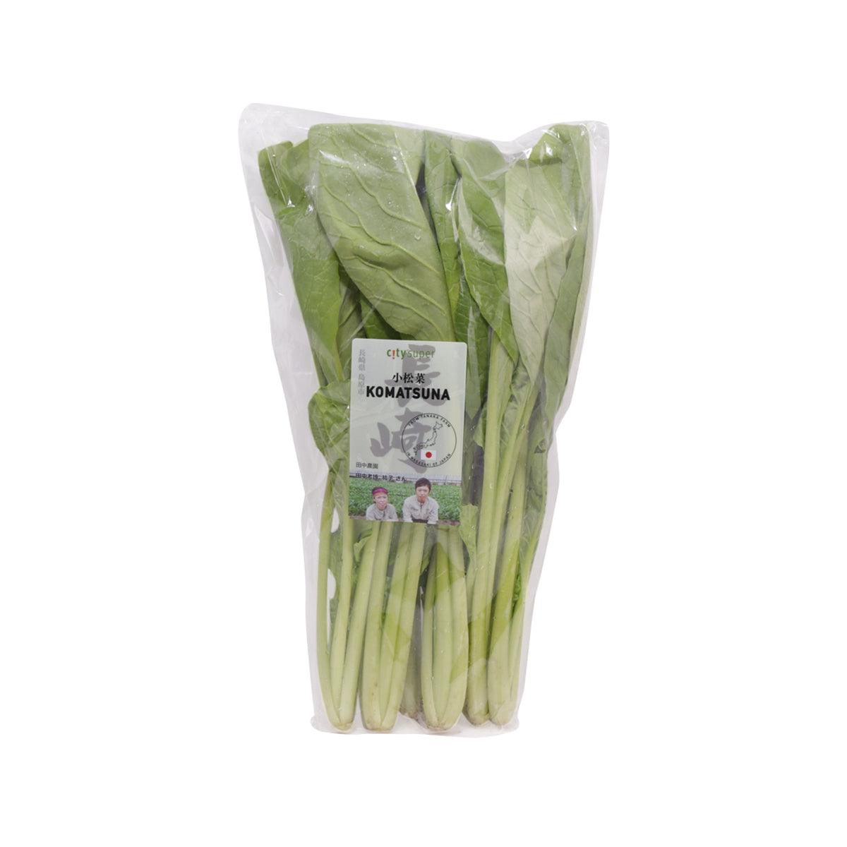 Packaged komatsuna mustard spinach in clear plastic bag with green leaves and stems