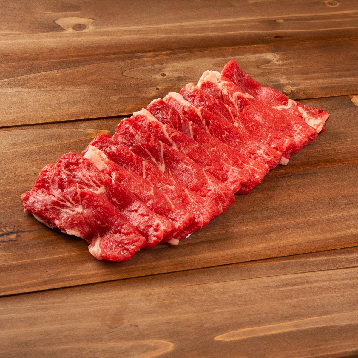 Raw beef rib eye steak, marbled red cut portion, for sukiyaki