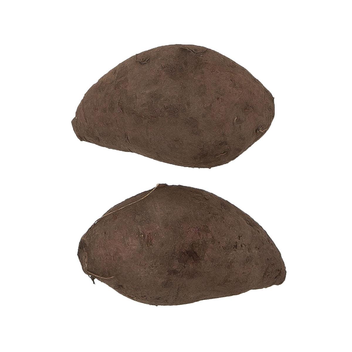 Whole sweet potatoes with brown skin, two pieces