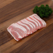 Pork belly slab with pink meat and white fat stripes