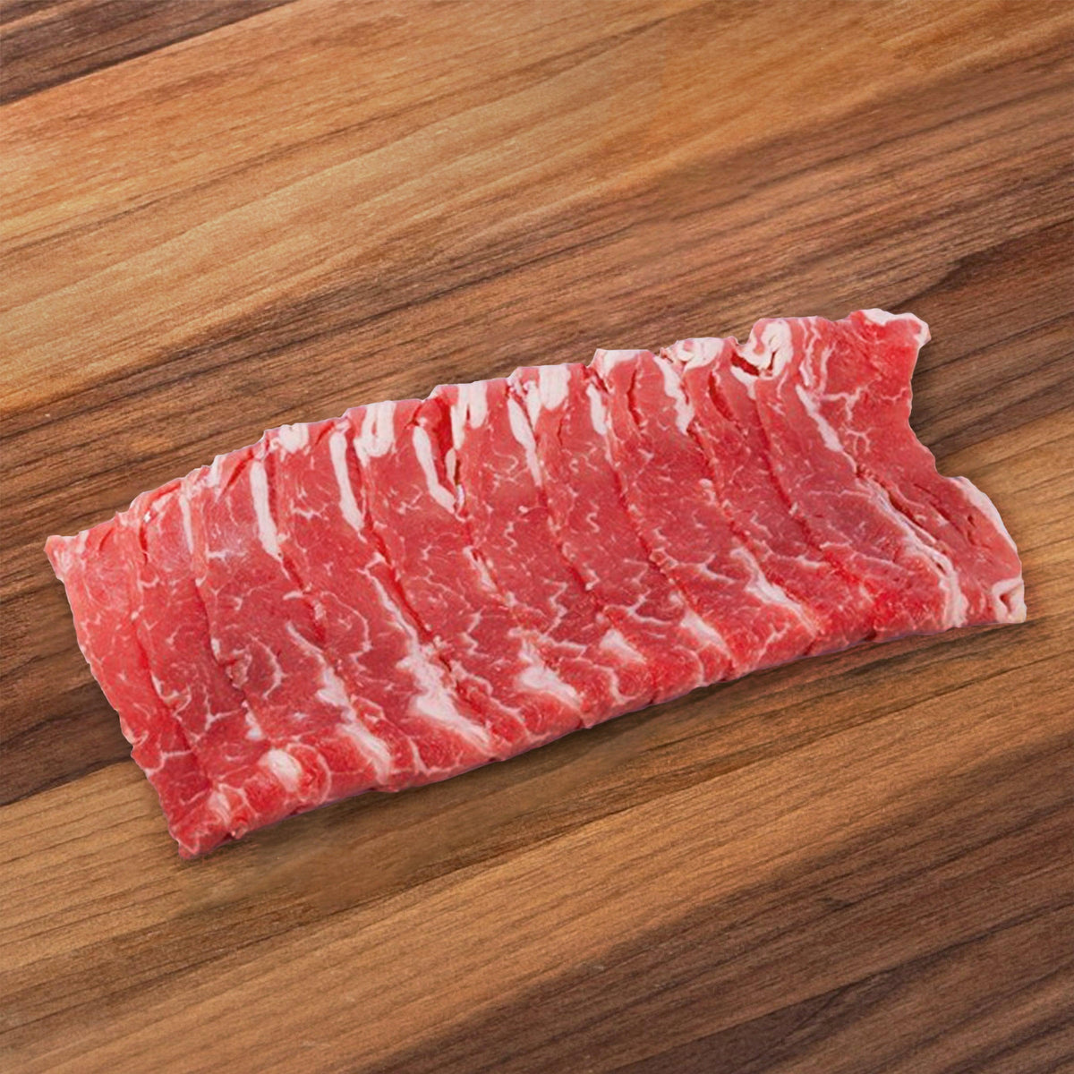 Raw boneless beef short rib, marbled red with white fat stripes