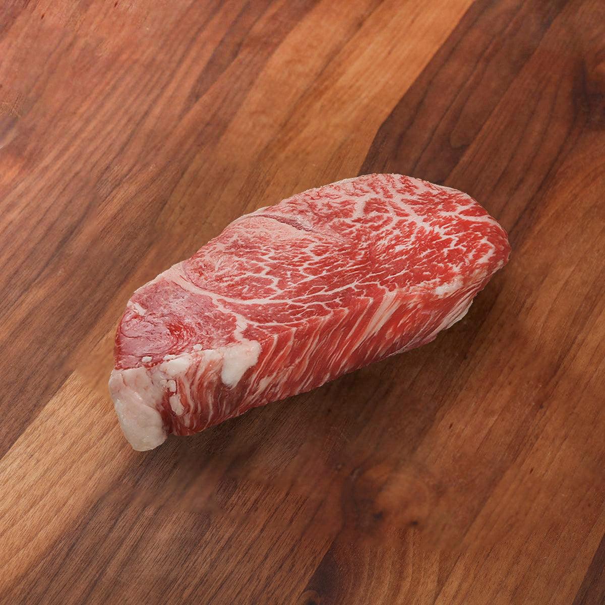 Chilled wagyu beef tenderloin steak piece with red marbling and pale fat