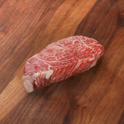 Chilled wagyu beef tenderloin steak piece with red marbling and pale fat