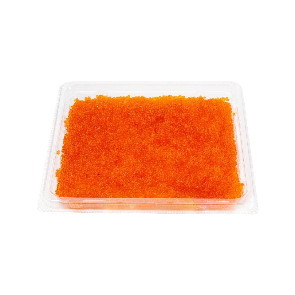 Flying fish roe in clear tray, rectangular slab of bright orange roe