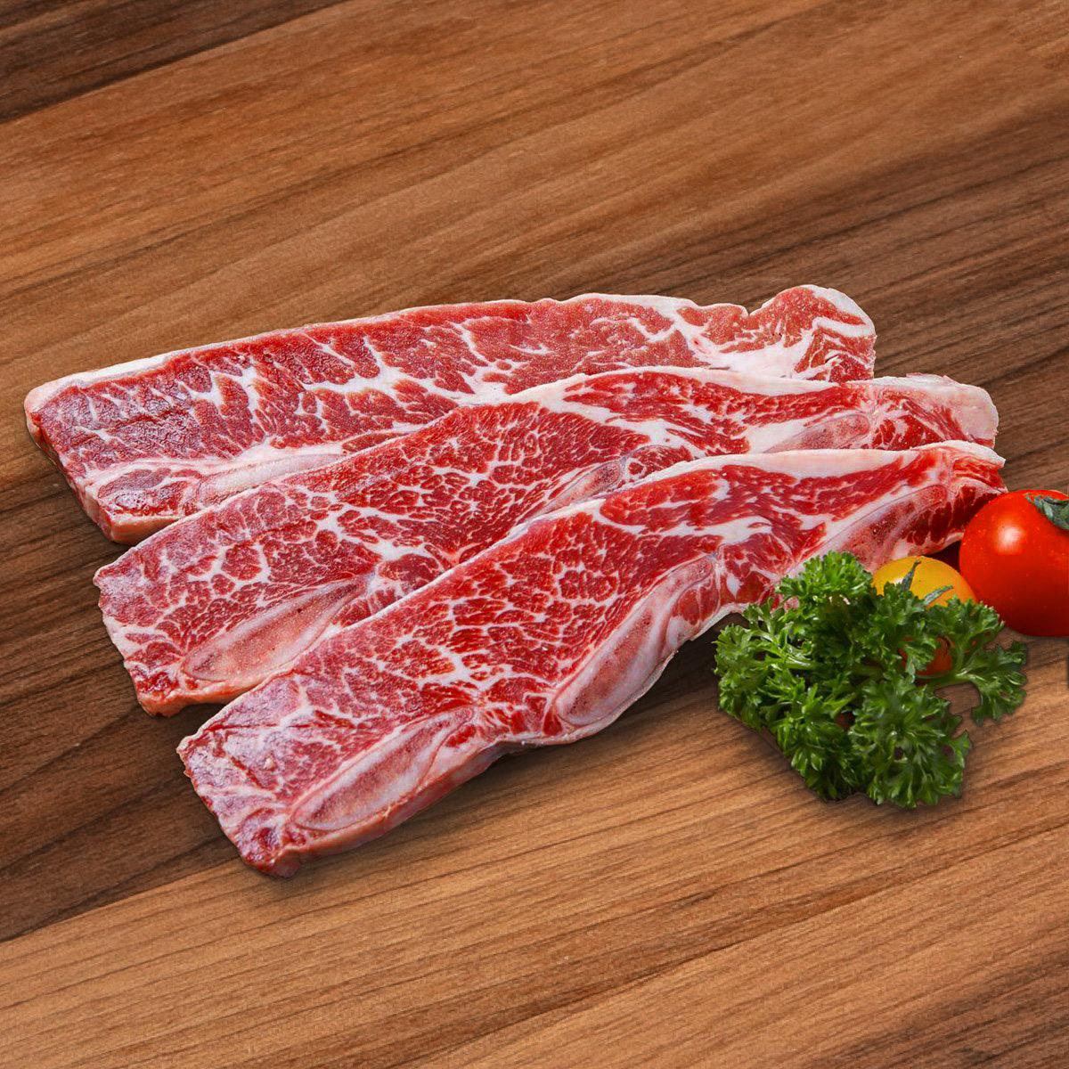 Beef short ribs with marbled red meat, uncooked portion