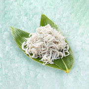 Dried whitebait heap in a green banana leaf