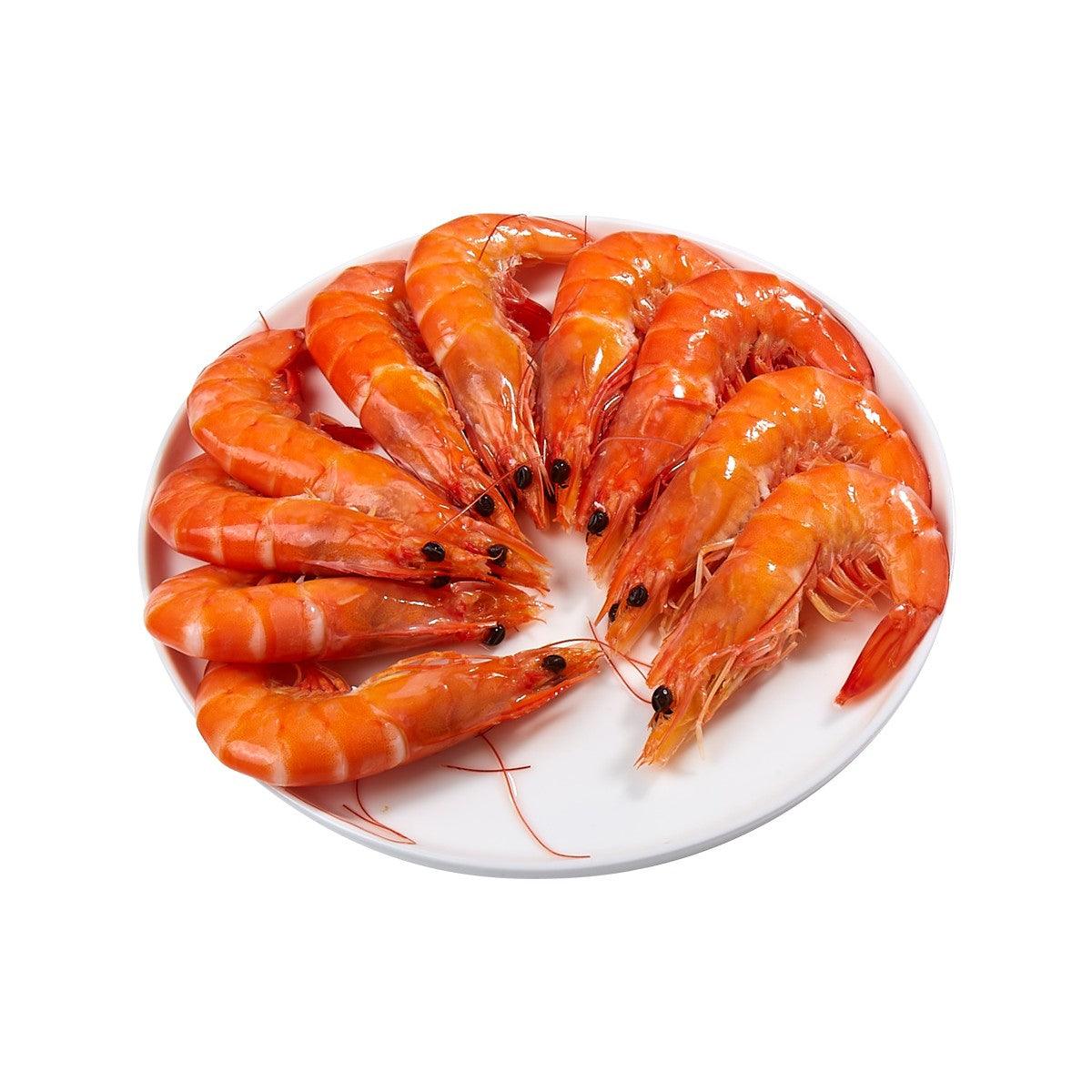 Plate of cooked orange vannamei prawns with tails, 250g