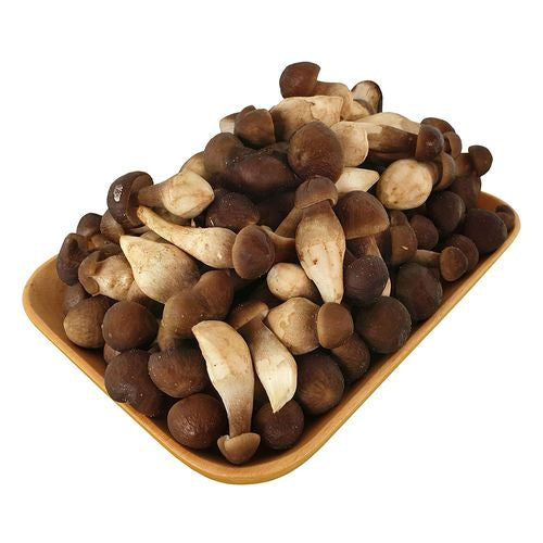 Fresh black termite mushrooms in a wooden tray, 200g