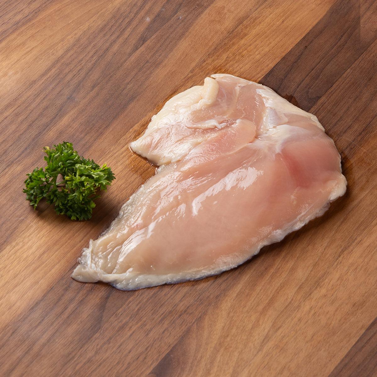 Frozen chicken breast fillet, pale pink raw poultry