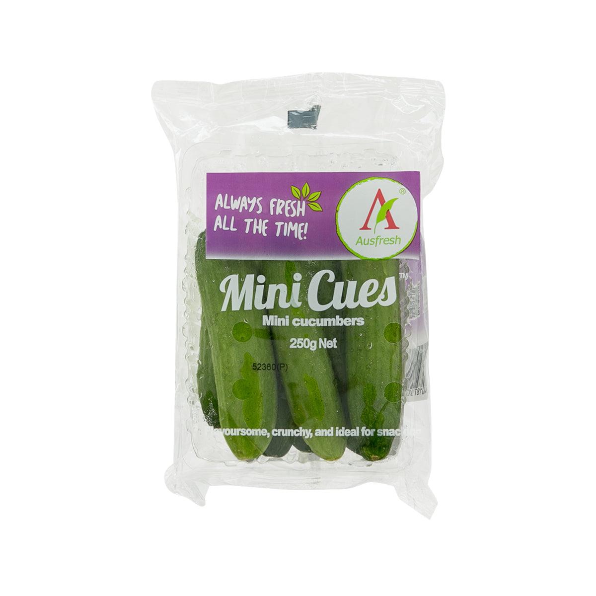Packaged mini cucumbers, green, in a clear bag