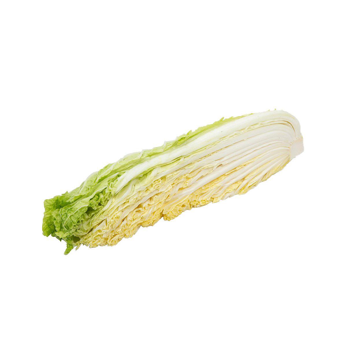 Quarter-cut Japanese Chinese cabbage with pale sliced layers and green outer leaves