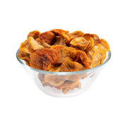 Dried Fuyu persimmon slices in clear bowl, orange-brown