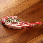 Bone-in chilled lamb rack chop with rosemary and garlic seasoning