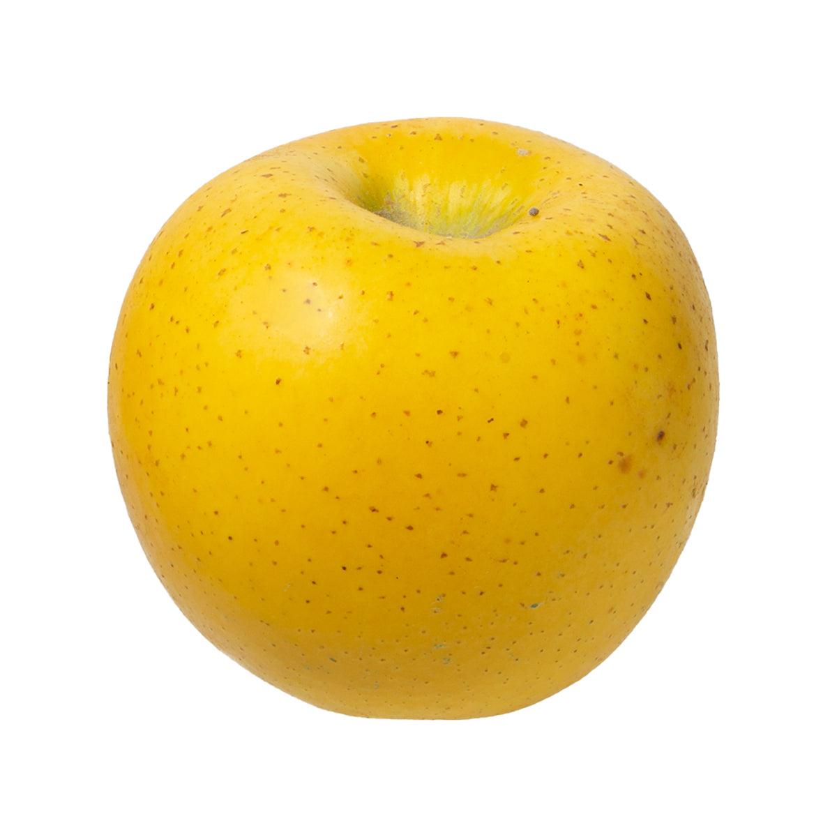 Fresh yellow apple with smooth skin and visible stem