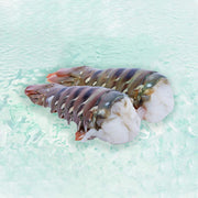 Previously frozen lobster tail, split shell with white meat (about 300g)