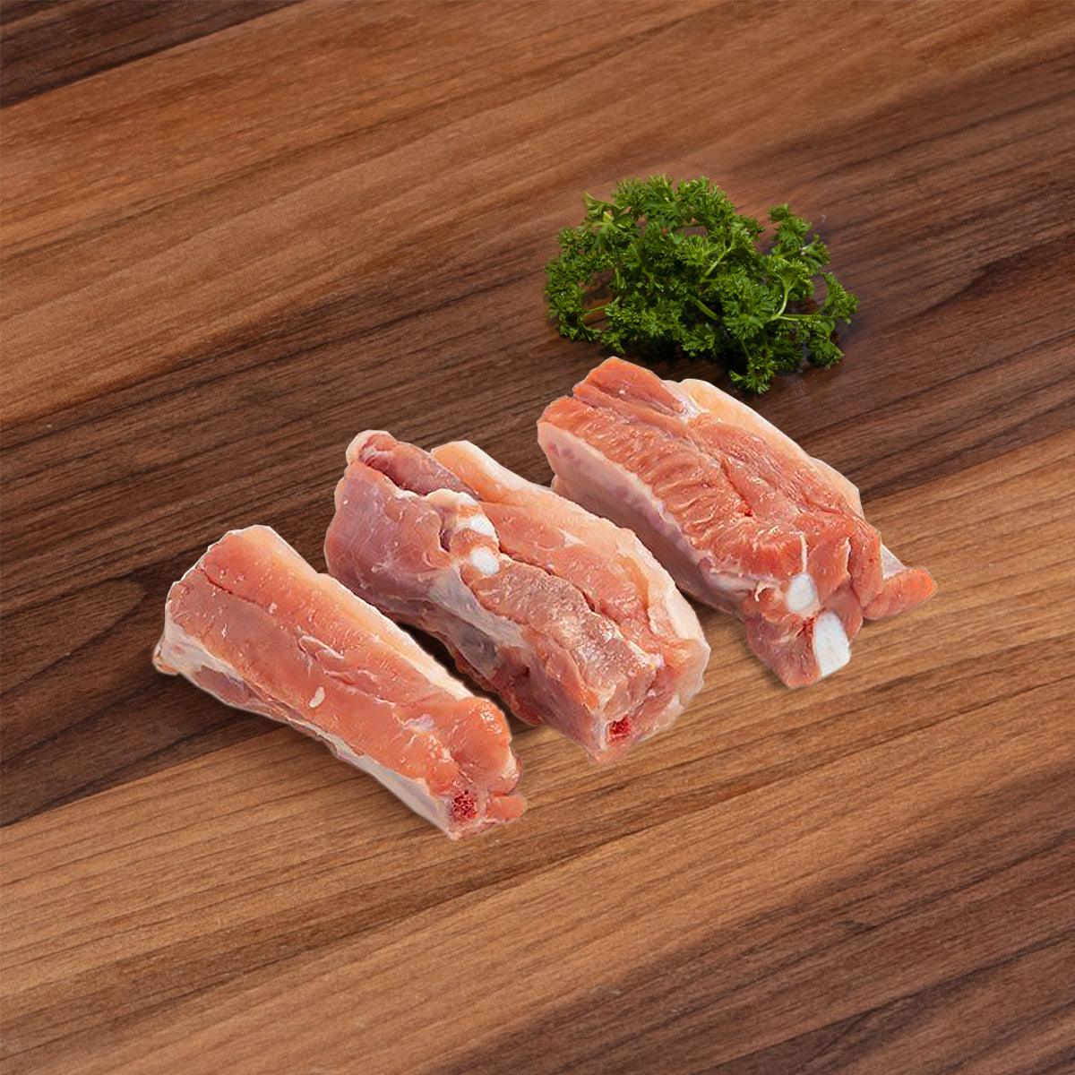 DAYLESFORD organic pork spare rib portions, raw meat and bones, ready for steaming